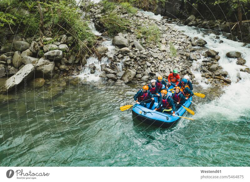 Group of people rafting in rubber dinghy on a river friends mate smile delight enjoyment Pleasant pleasure Cheerfulness exhilaration gaiety gay glad Joyous
