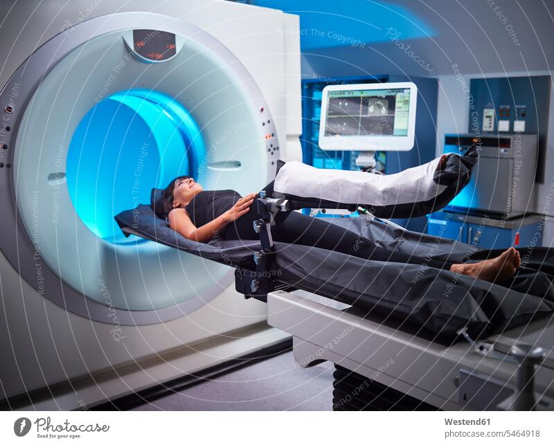 Woman having an MRI examination in hospital MRT magnetic resonance tomography Medical Clinic examine examinations examining woman females women patient