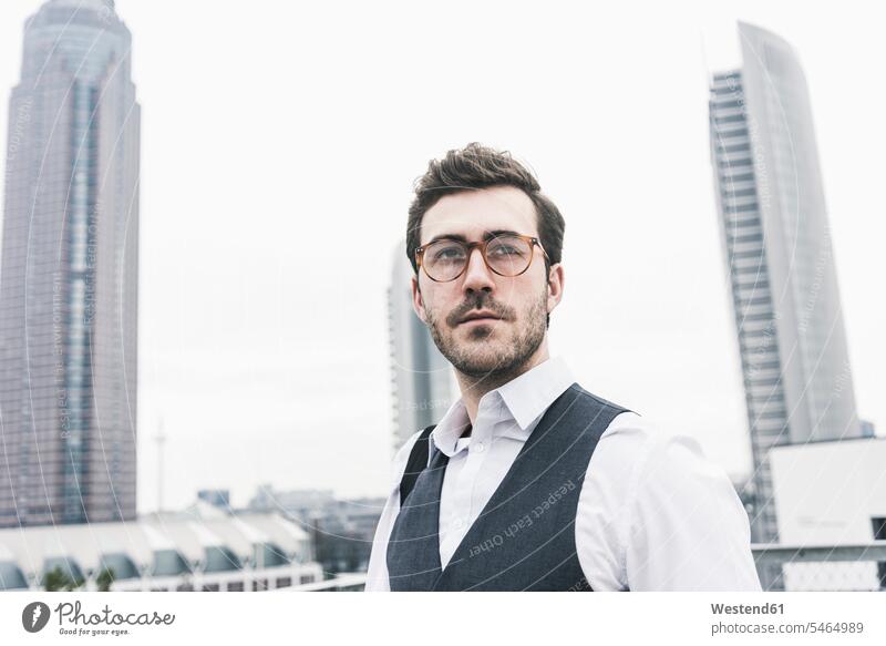 Germany, Frankfurt, portrait of young businessman in the city Businessman Business man Businessmen Business men town cities towns portraits business people