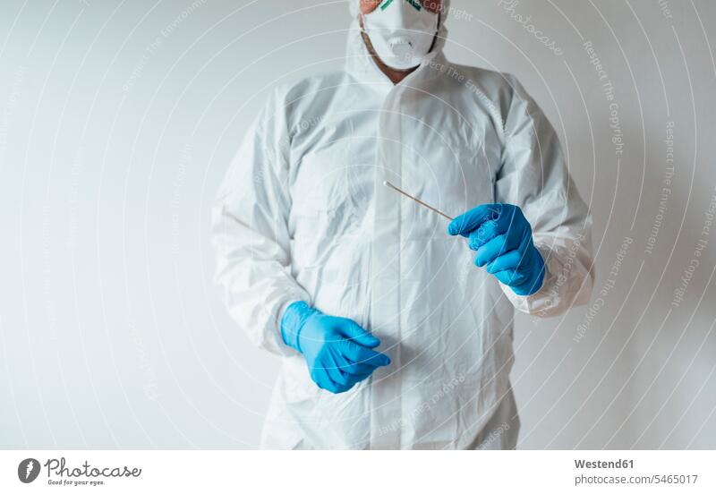 Doctor holding a swab cotton stick (value=0) Occupation Work job jobs profession professional occupation gloves At Work White Colors health healthcare