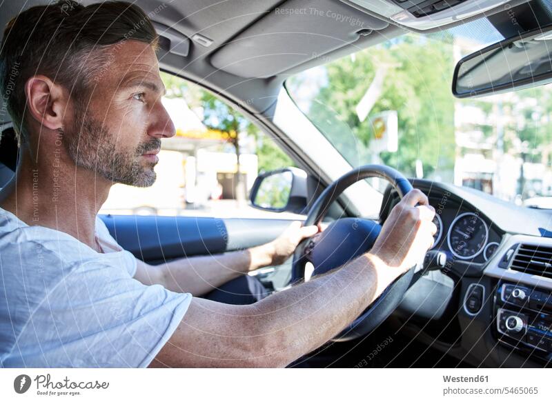 Mature man driving car human human being human beings humans person persons caucasian appearance caucasian ethnicity european 1 one person only only one person