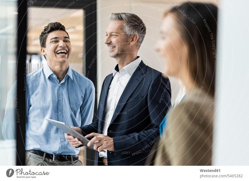 Smiling mature businessman and employees in office Occupation Work job jobs profession professional occupation superior supervisor the boss business life