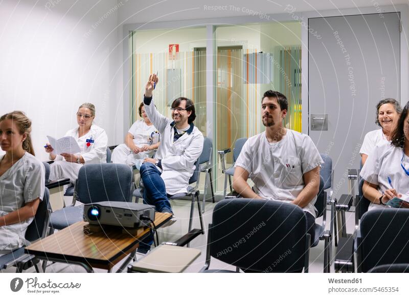 Doctors discussing in meeting at board room color image colour image Spain indoors indoor shot indoor shots interior interior view Interiors