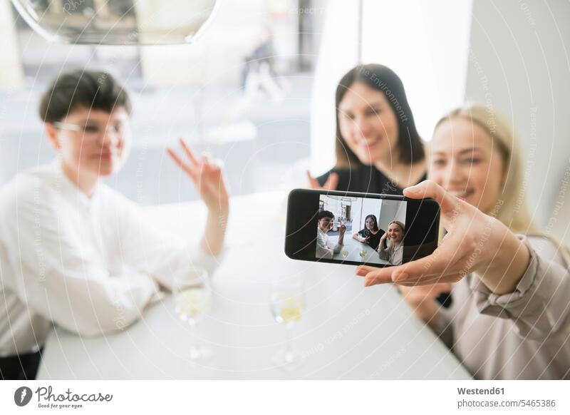 Happy friends taking selfie in a restaurant hand human hand hands human hands motif motive Hand Sign hand gesture hand signal posing pose Posed togetherness