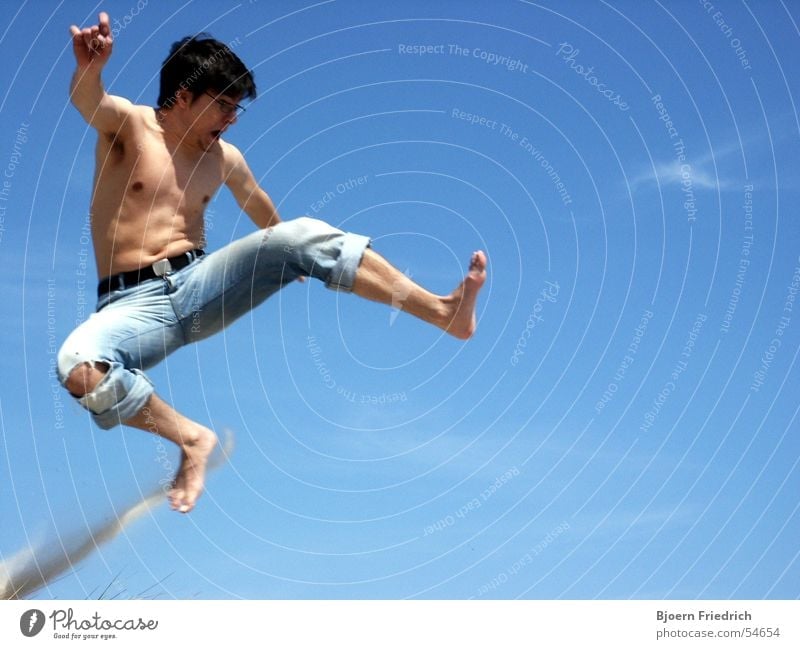 Karate Kid Man Jump Martial arts Kickboxing Scream Vacation & Travel Summer Dust Upper body Human being teakwondo Legs Feet Electricity Aviation Flying Sky