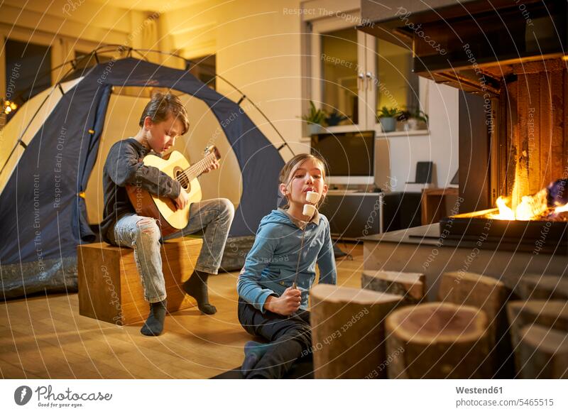 Brother and sister barbecueing and camping in the living room Instrument Instruments musical instruments stringed instruments guitars acoustic guitars