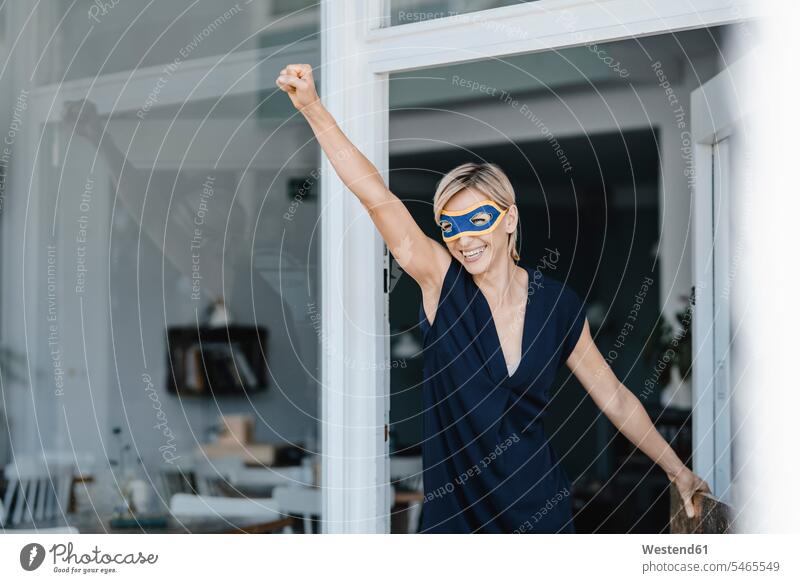 Businesswoman wearing super hero masks, pretending to fly human human being human beings humans person persons caucasian appearance caucasian ethnicity european