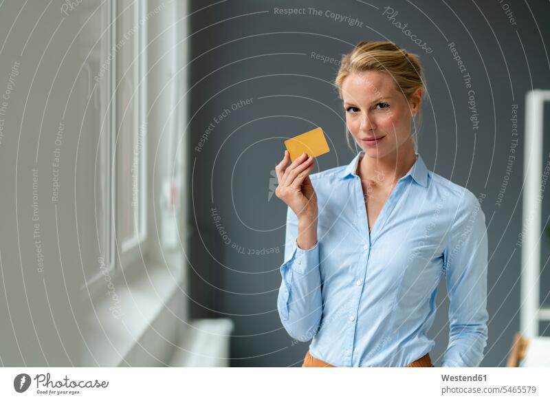 Portrait of young woman holding credit card business life business world business person businesspeople business woman business women businesswomen windows