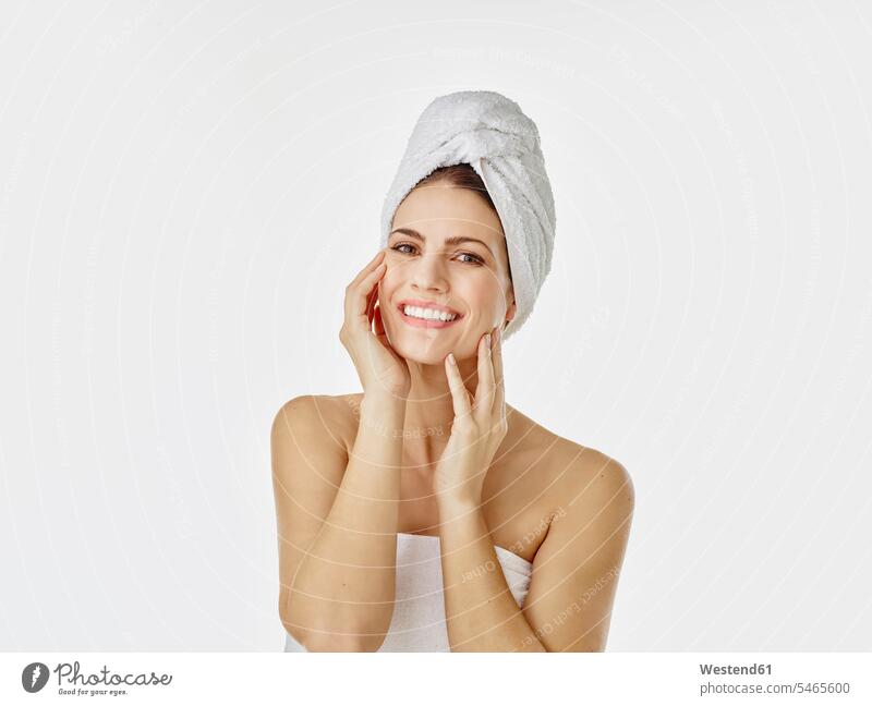 Portrait of smiling woman with hairs wrapped in towel against white background human human being human beings humans person persons caucasian appearance