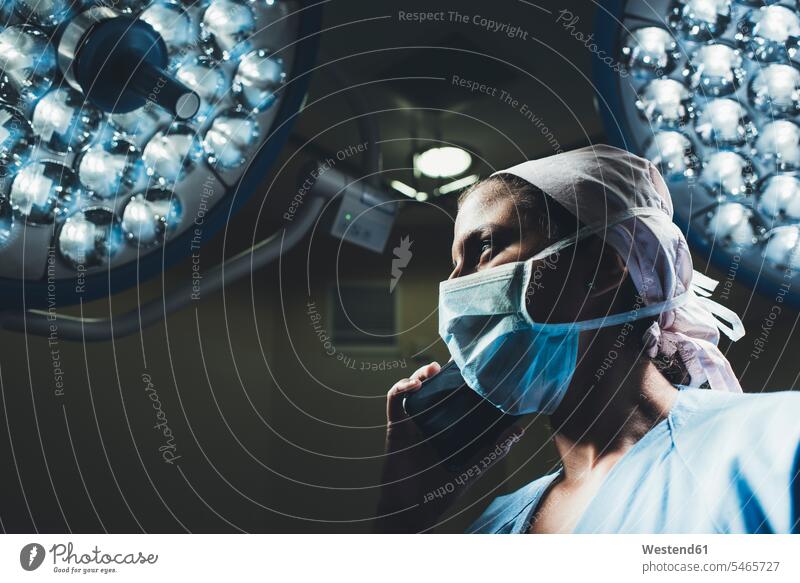 Nurse on the phone in operating room human human being human beings humans person persons caucasian appearance caucasian ethnicity european 1 one person only