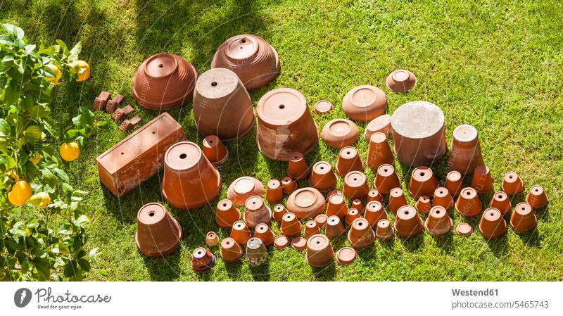 Empty flower pots standing upside down on grass Terracotta various different variation sunshine Sunny Day sunny large group of objects many objects flowerpot