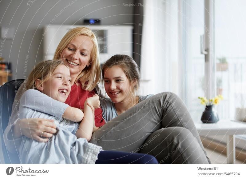Happy mother and daughters having fun at home Fun funny laughing Laughter happiness happy mommy mothers ma mummy mama positive Emotion Feeling Feelings