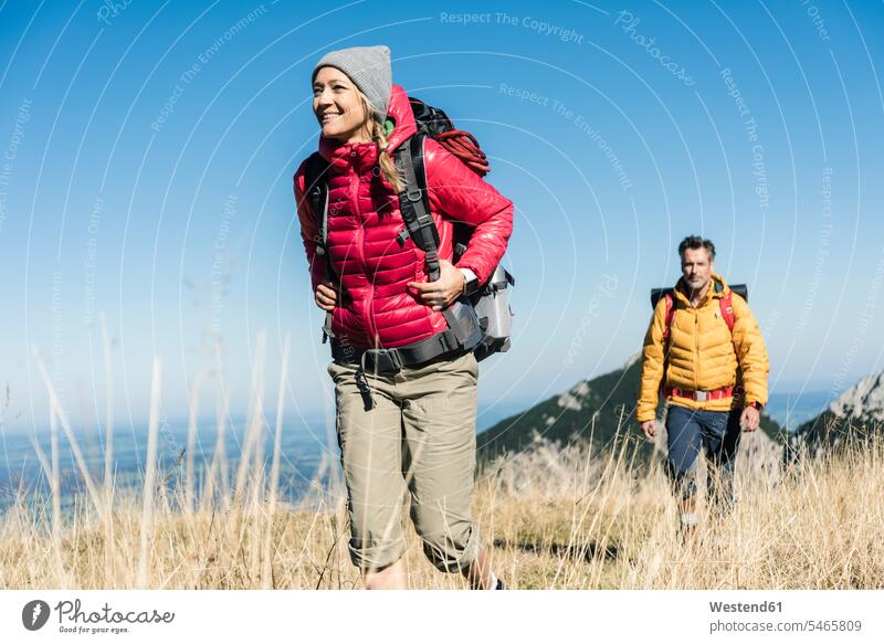 Austria, Tyrol, couple hiking in the mountains hike mountain range mountain ranges twosomes partnership couples landscape landscapes scenery terrain