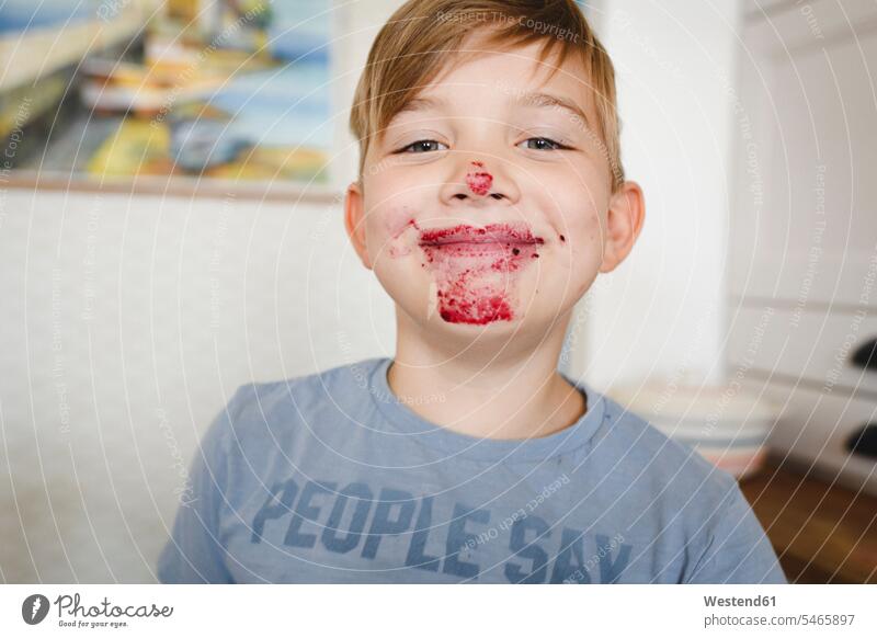 Portrait of grinning boy with blueberry jam in his face heads faces human face human faces T- Shirt t-shirts tee-shirt smile delight enjoyment Pleasant pleasure