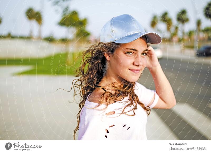 Portrait of girl with basecap looking at camera looking to camera looking at the camera Eye Contact females girls leisure free time leisure time portrait