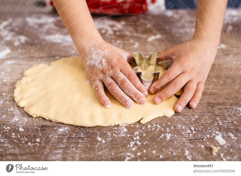Boy's hands cutting out cookies, close-up trumping cut out Biscuit Cookie Cooky Cookies Biscuits human hand human hands boy boys males Pastry Pastries