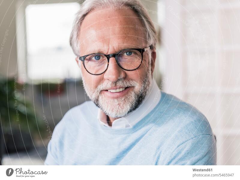 Portrait of smiling mature man with grey hair and beard wearing glasses smile portrait portraits grey-haired gray-haired gray hair gray hairs specs Eye Glasses