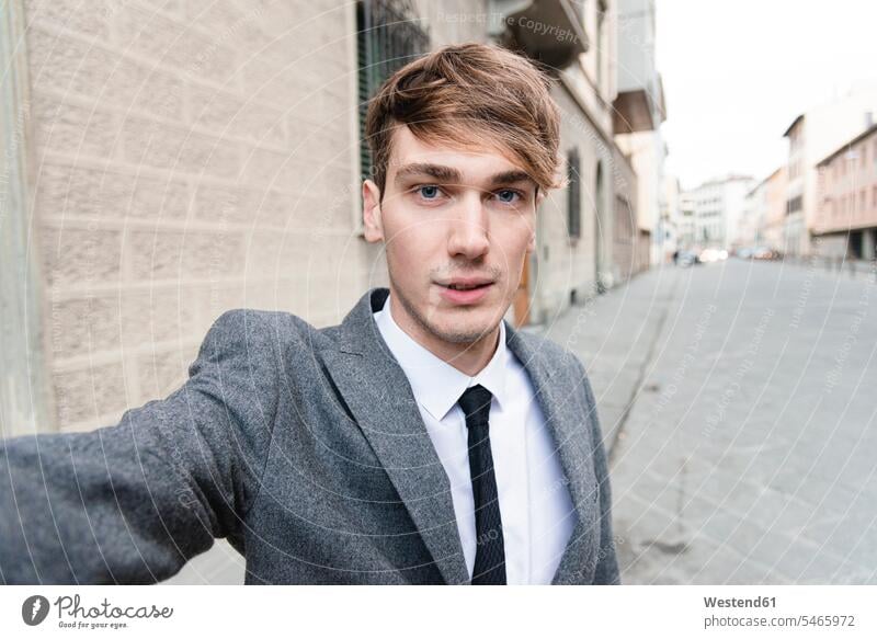 Portrait of young businessman taking selfie in the city business life business world business person businesspeople Business man Business men Businessmen
