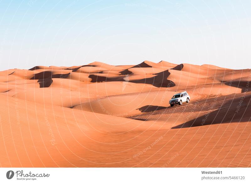 Sultanate Of Oman, Wahiba Sands, Dune bashing in an SUV off-road vehicle journey travelling Journeys voyage structure structures clear sky cloudless vastness