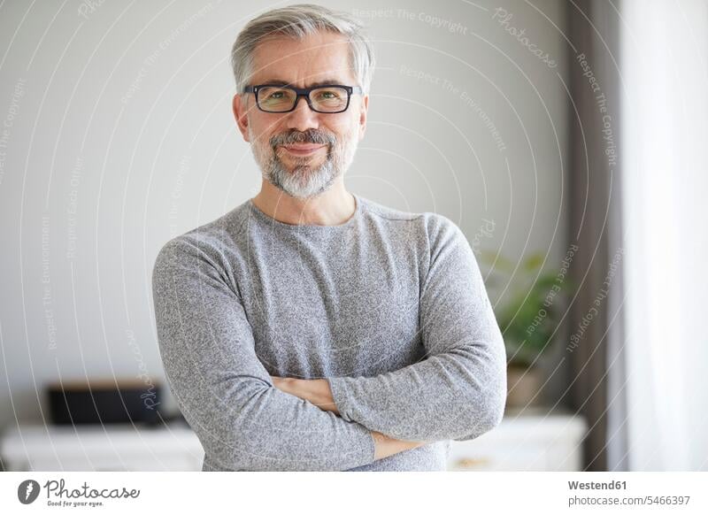 Portrait of content mature man at home pleased men males portrait portraits Adults grown-ups grownups adult people persons human being humans human beings flat