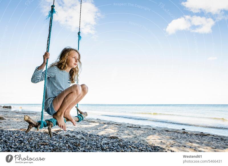 Girl on a swing at the beach girl females girls swing set playground swing swingset beaches child children kid kids people persons human being humans