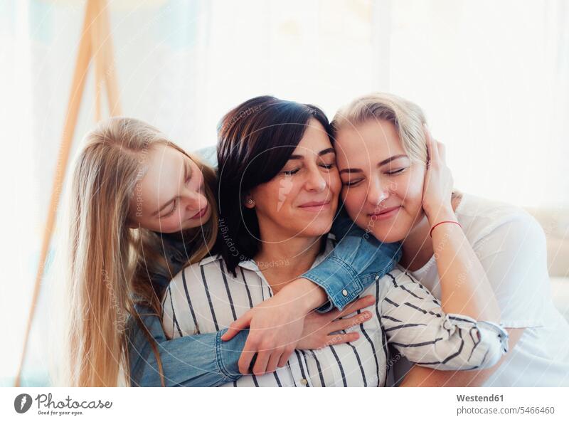 Visiting daughters embracing their mother human human being human beings humans person persons caucasian appearance caucasian ethnicity european adult grown-up