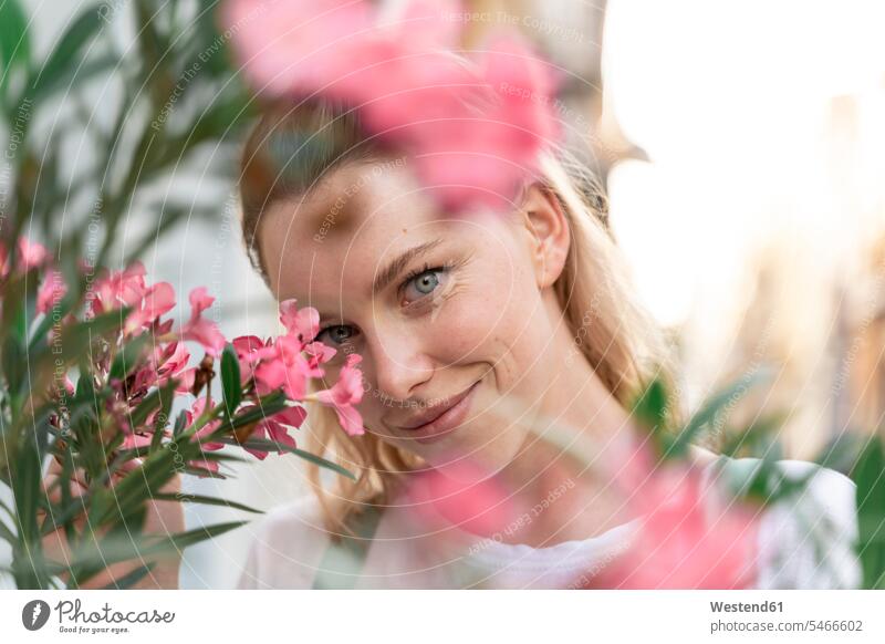 Portrait of young wiman with pink oleander flowers human human being human beings humans person persons caucasian appearance caucasian ethnicity european 1