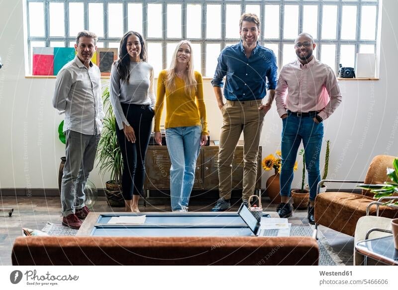 Portrait of confident business team in loft office confidence portrait portraits offices office room office rooms lofts business world business life workplace