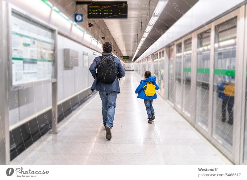 Father and daughter on metro station, girl running away human human being human beings humans person persons caucasian appearance caucasian ethnicity european 2
