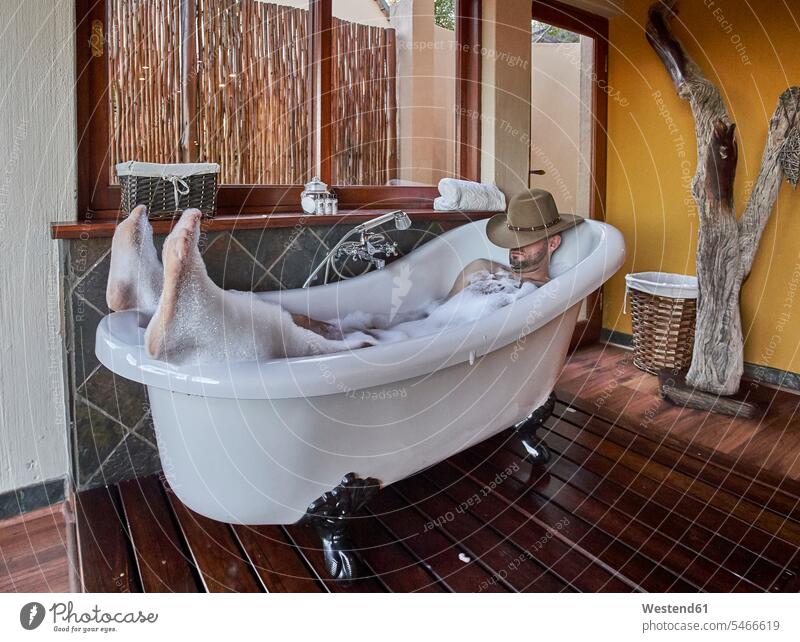 Man having a relaxing bath in the bathtub human human being human beings humans person persons caucasian appearance caucasian ethnicity european 1