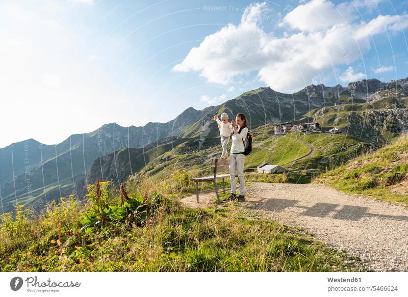 Germany, Bavaria, Oberstdorf, mother and little daughter on a hike in the mountains daughters hiking mommy mothers mummy mama child children family families