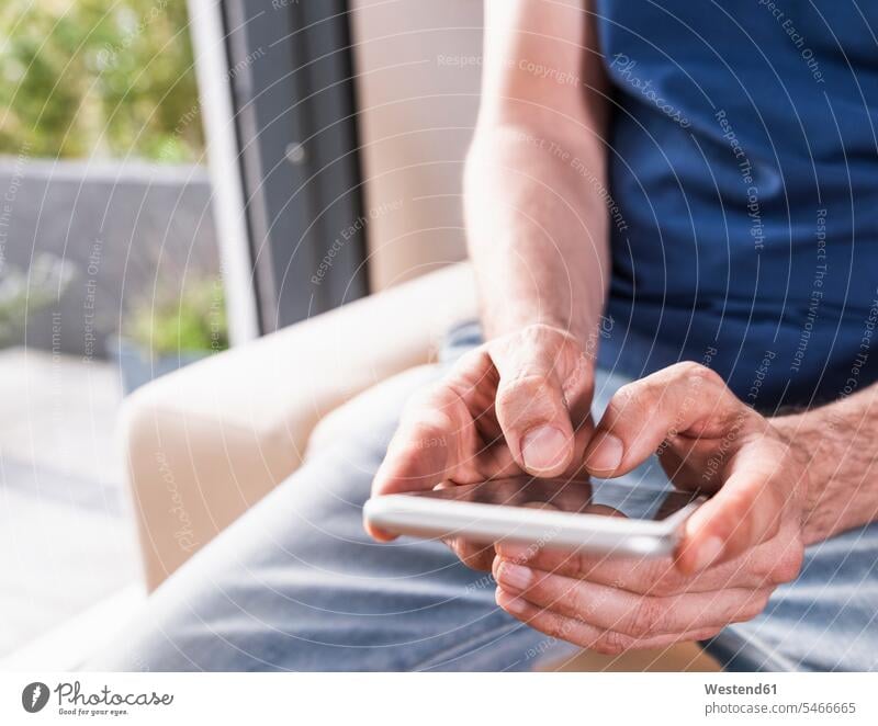 Man's hands text messaging, close-up human hand human hands men males SMS Text Message people persons human being humans human beings Adults grown-ups grownups