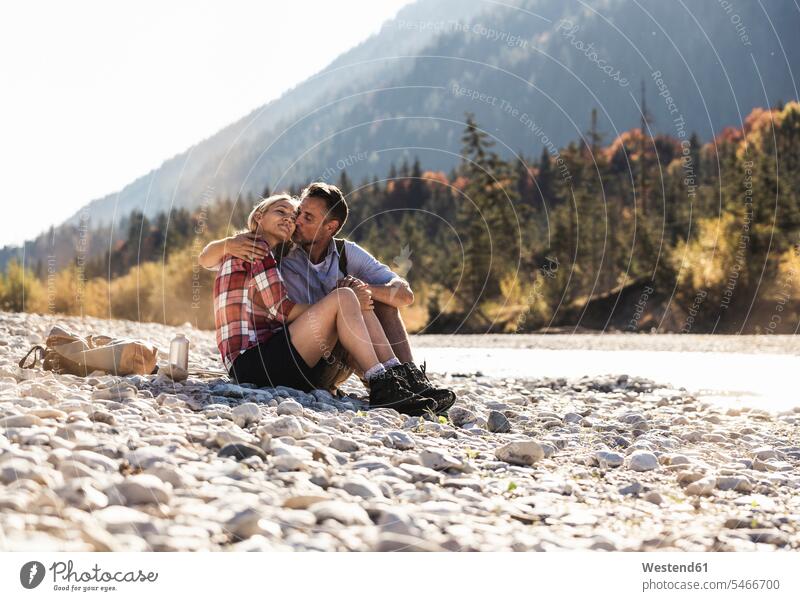 Austria, Alps, affectionate couple on a hiking trip having a break at a brook caucasian caucasian appearance caucasian ethnicity european White - Caucasian