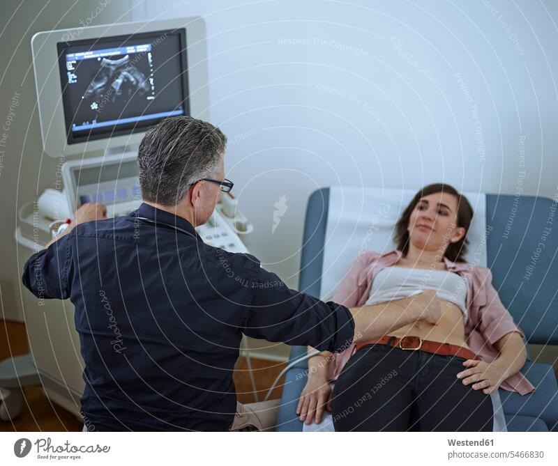 Woman in hospital getting sonogram doctor physicians doctors woman females women Medical Clinic Ultrasonography healthcare and medicine medical
