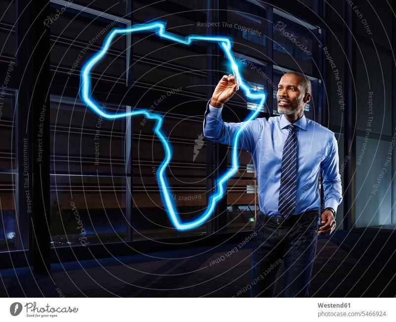Businessman painting Africa with light Business man Businessmen Business men Shirt and Tie lightpainting goal goals trading mature men mature man one person 1