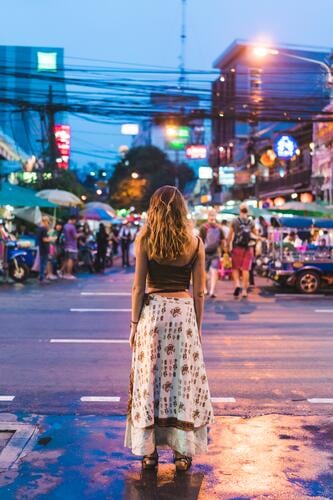 Thailand, Bangkok, young woman in the city standing on the street at night females women by night nite night photography town cities towns road streets roads