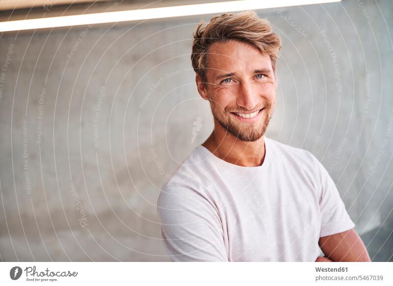 Portrait of smiling young man wearing white t-shirt human human being human beings humans person persons caucasian appearance caucasian ethnicity european 1