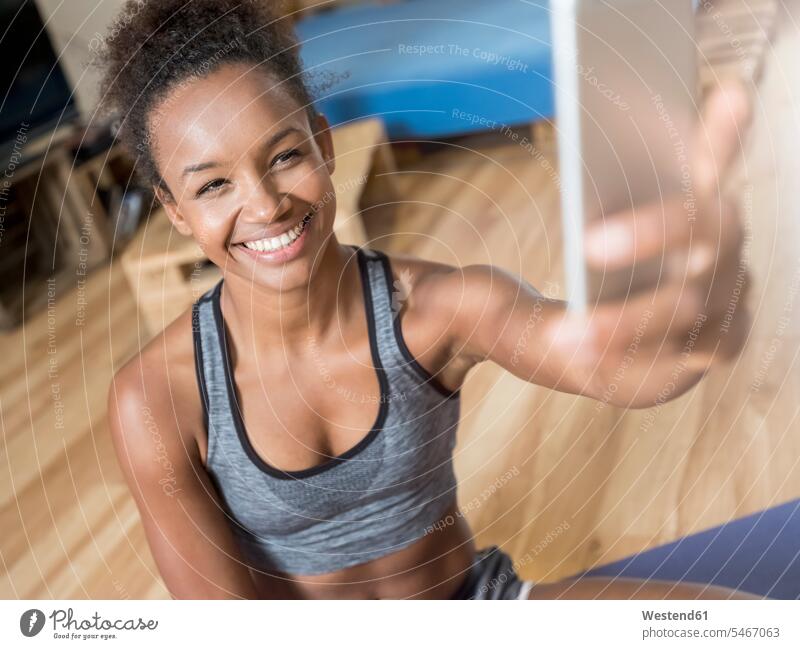 Smiling young woman in sportswear taking a selfie Selfie Selfies smiling smile Sportswear Activewear Sport Clothes Sports Clothes Sports Wear Sports Clothing