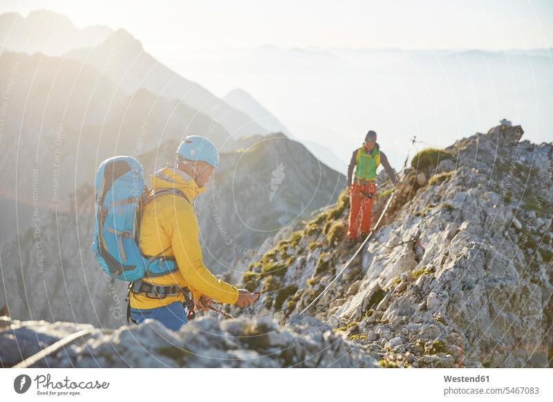 Austria, Tyrol, Innsbruck, mountaineer at Nordkette via ferrata Adventure adventurous Adventures climbing rock climbing alpinism sport sports climber alpinists
