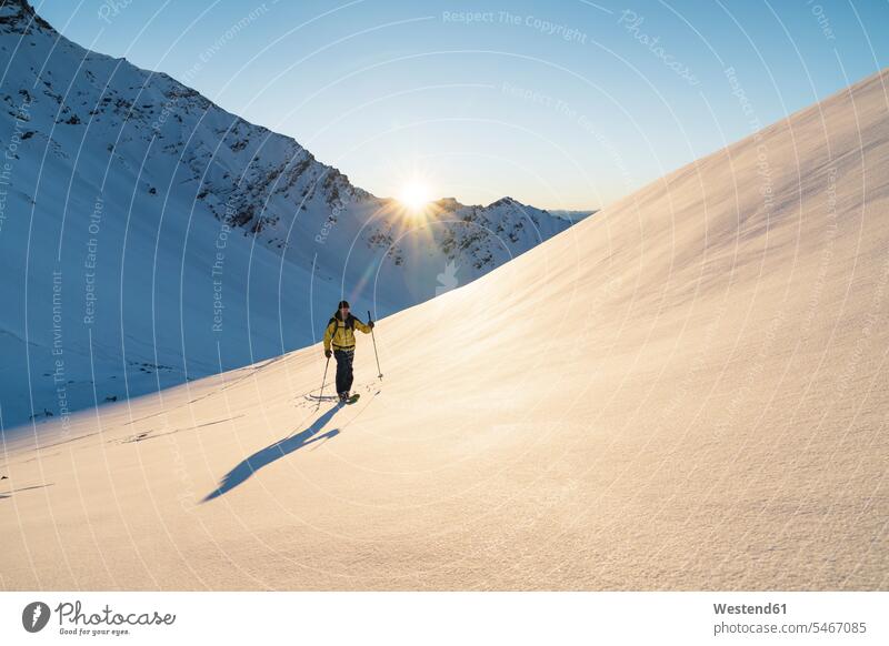 Man during ski tour, Lenzerheide, Grisons, Switzerland seasons hibernal chilly Cold Temperature Cold Weather sports athletes Sportsman Sportsmen Sportspeople