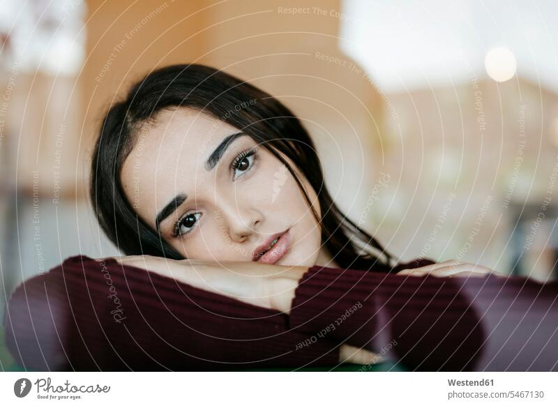 Portrait of young woman behind windowpane human human being human beings humans person persons Middle Eastern 1 one person only only one person adult grown-up