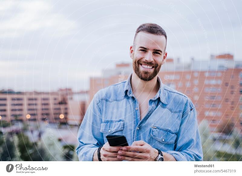 Portrait of relaxed young man with smartphone outdoors human human being human beings humans person persons caucasian appearance caucasian ethnicity european 1