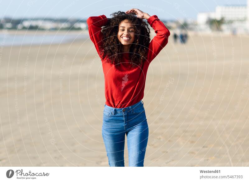 Portrait of happy young woman on the beach females women beaches portrait portraits happiness Adults grown-ups grownups adult people persons human being humans