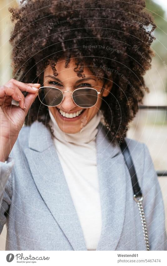 Portrait of happy woman wearing sunglasses females women sun glasses Pair Of Sunglasses portrait portraits happiness Adults grown-ups grownups adult people