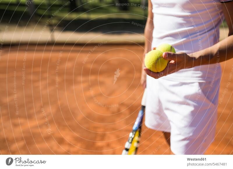 Man holding tennis balls during tennis match human human being human beings humans person persons caucasian appearance caucasian ethnicity european 1
