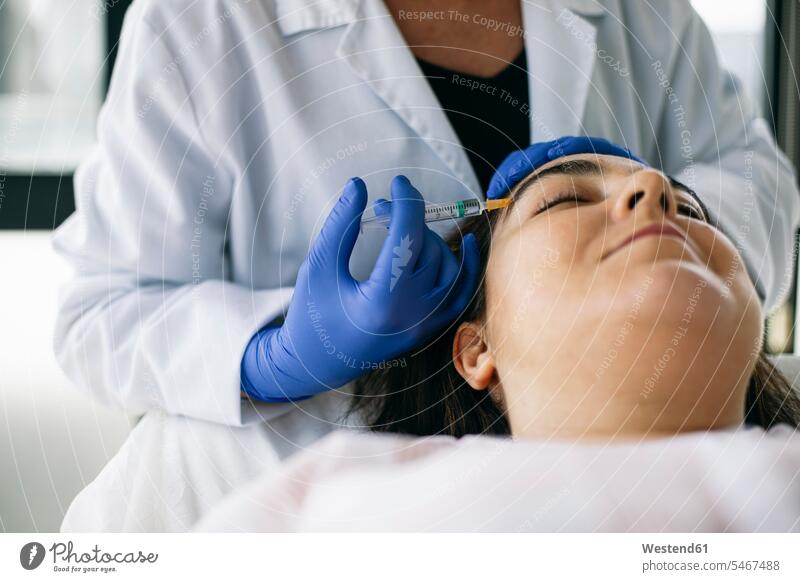 Woman receiving hyaluronic acid injection in medical practice human human being human beings humans person persons caucasian appearance caucasian ethnicity