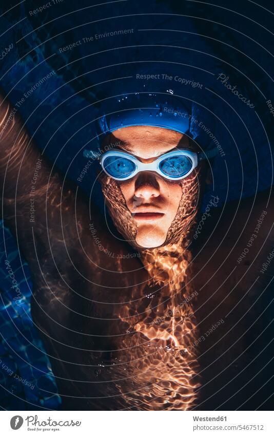 Portrait of paralympic young swimmer floating on water in a pool exercise practising train training colour colours sports free time leisure time
