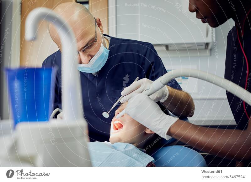 Boy receiving dental treatment health healthcare Healthcare And Medicines medical medicine patients Occupation Work job jobs profession professional occupation
