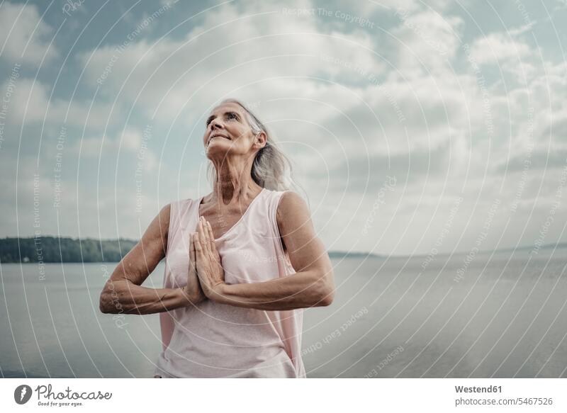 Senior woman meditation at the sea human human being human beings humans person persons caucasian appearance caucasian ethnicity european 1 one person only