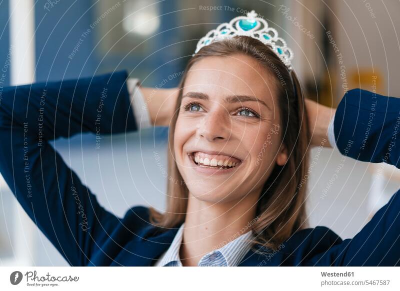 Ambitious young woman wearing crown as an award for her achievments Success successful cheerful gaiety Joyous glad Cheerfulness exhilaration merry gay special